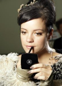 Lily Allen sporting Particulière at the SS10 Chanel show at Paris Fashion Week.